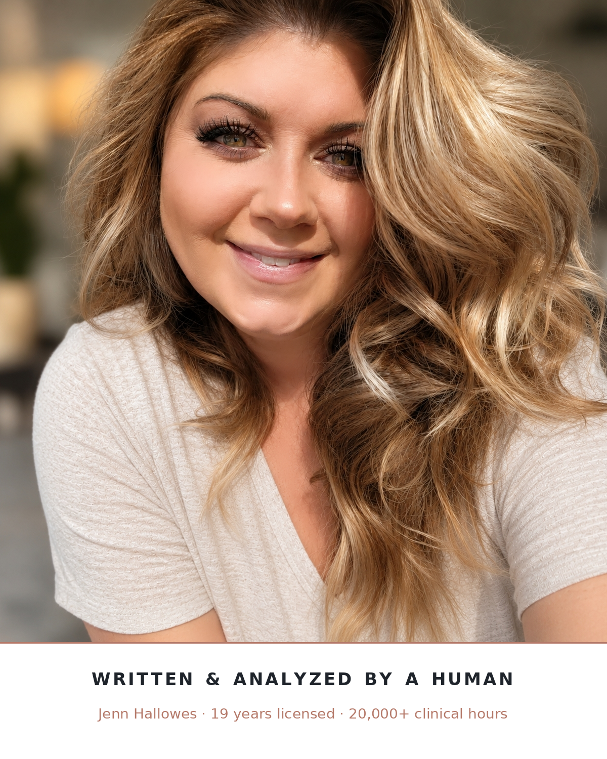 A smiling woman with long wavy blonde hair and a light beige V-neck top, with text at the bottom reading 'Written & Analyzed by a Human' and 'Jenn Hallowes - 19 years licensed - 20,000+ clinical hours'.